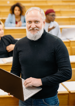 An instructor standing in a lecture hall
